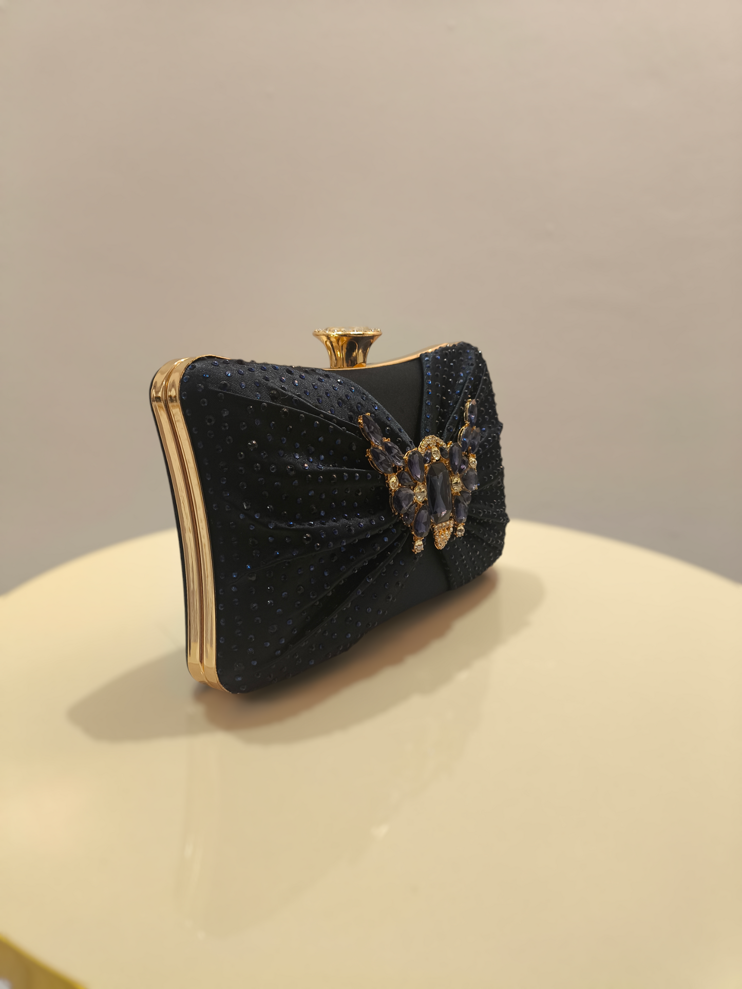 Stylish ladies clutch handbag with brooch