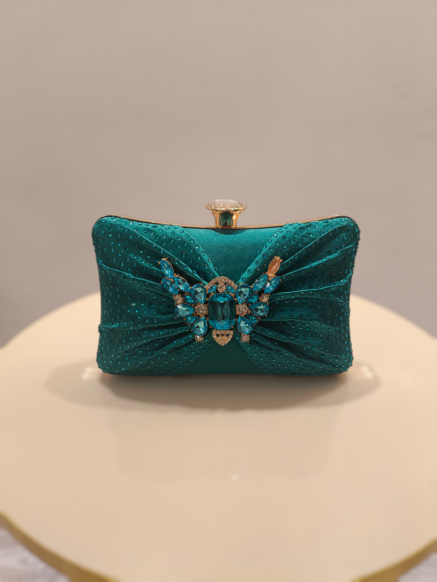 Stylish ladies clutch handbag with brooch