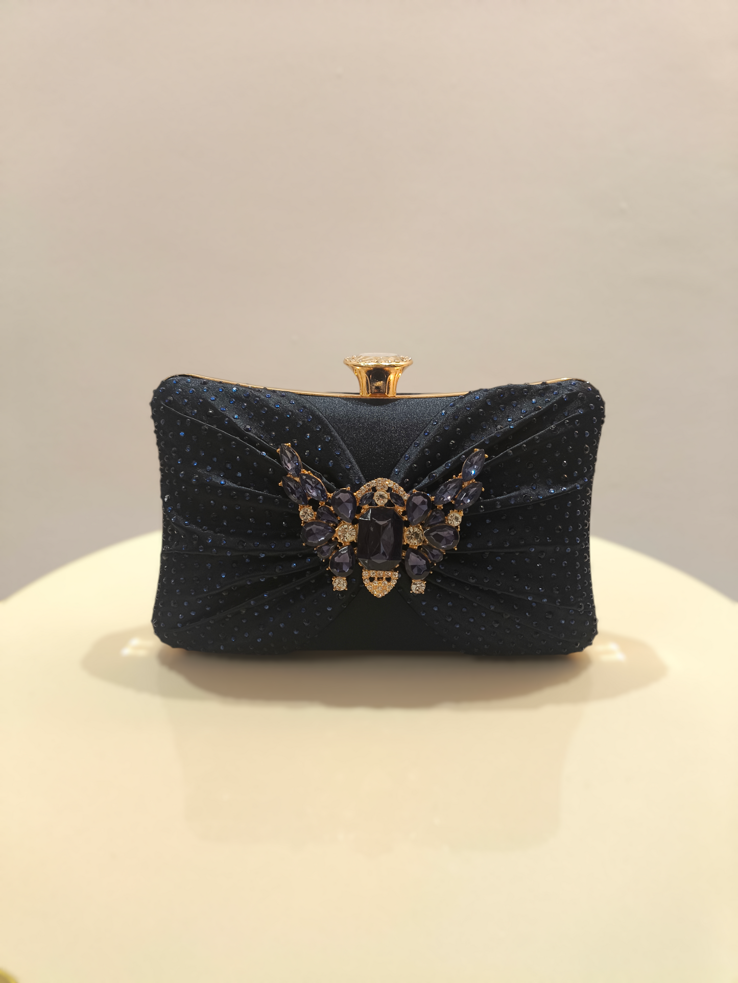 Stylish ladies clutch handbag with brooch