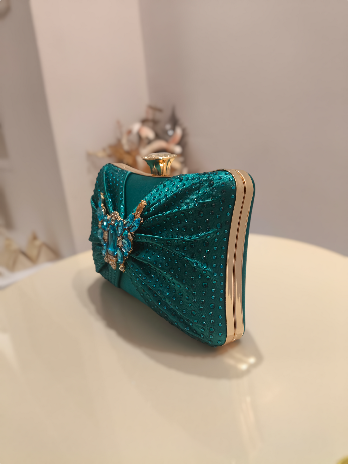 Stylish ladies clutch handbag with brooch