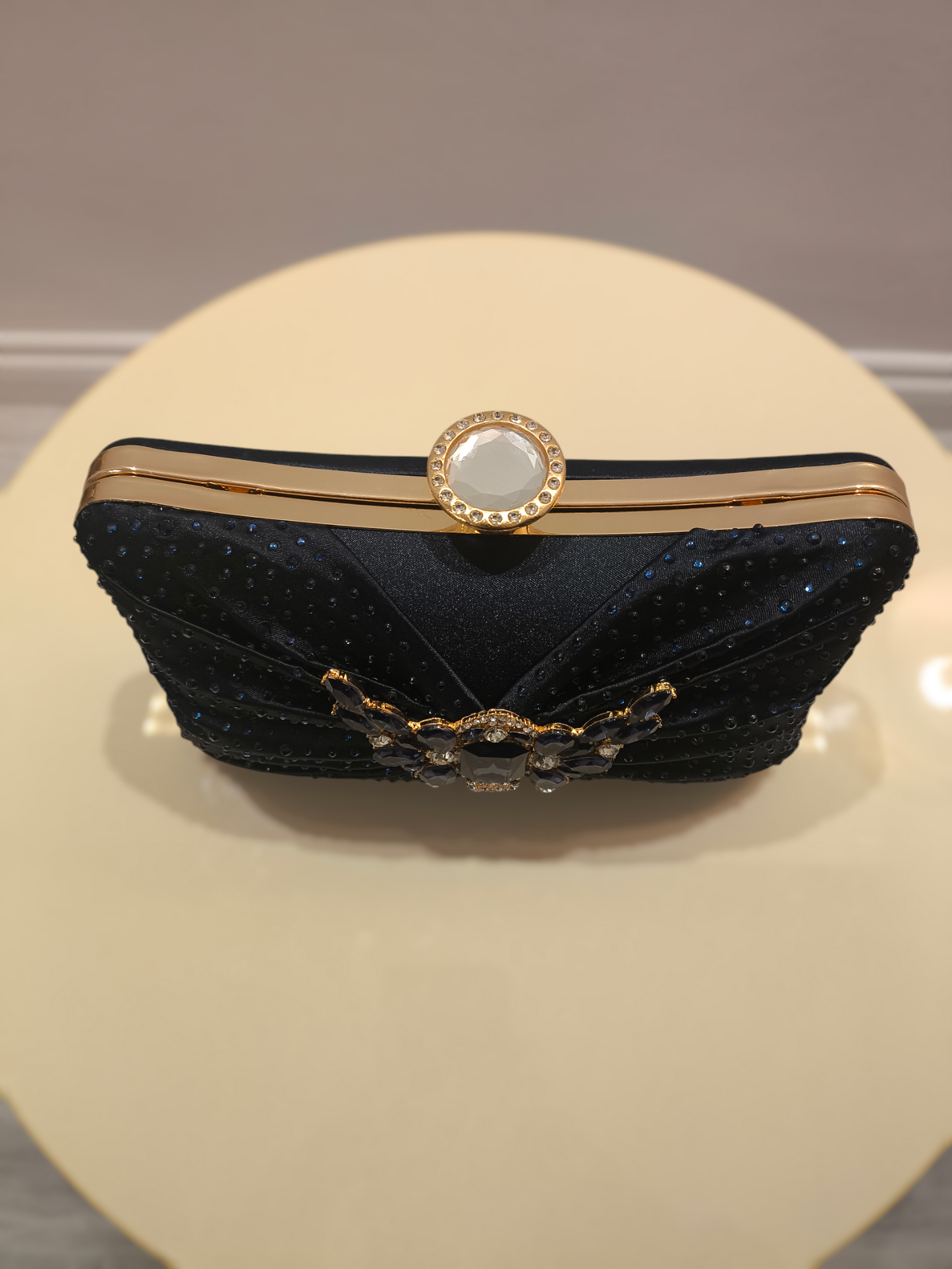 Stylish ladies clutch handbag with brooch