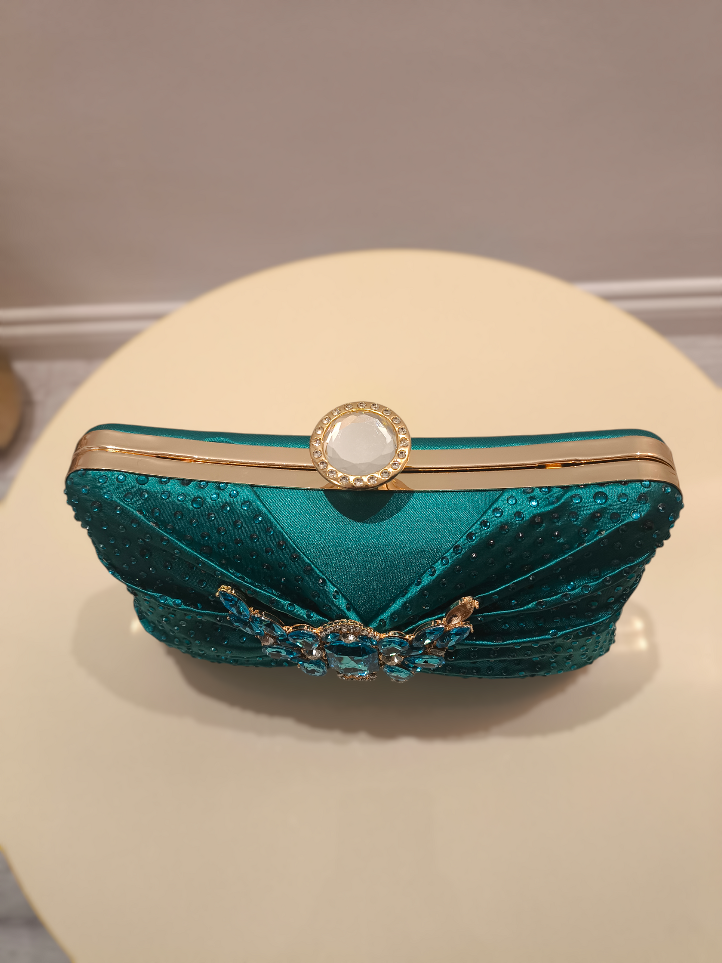 Stylish ladies clutch handbag with brooch