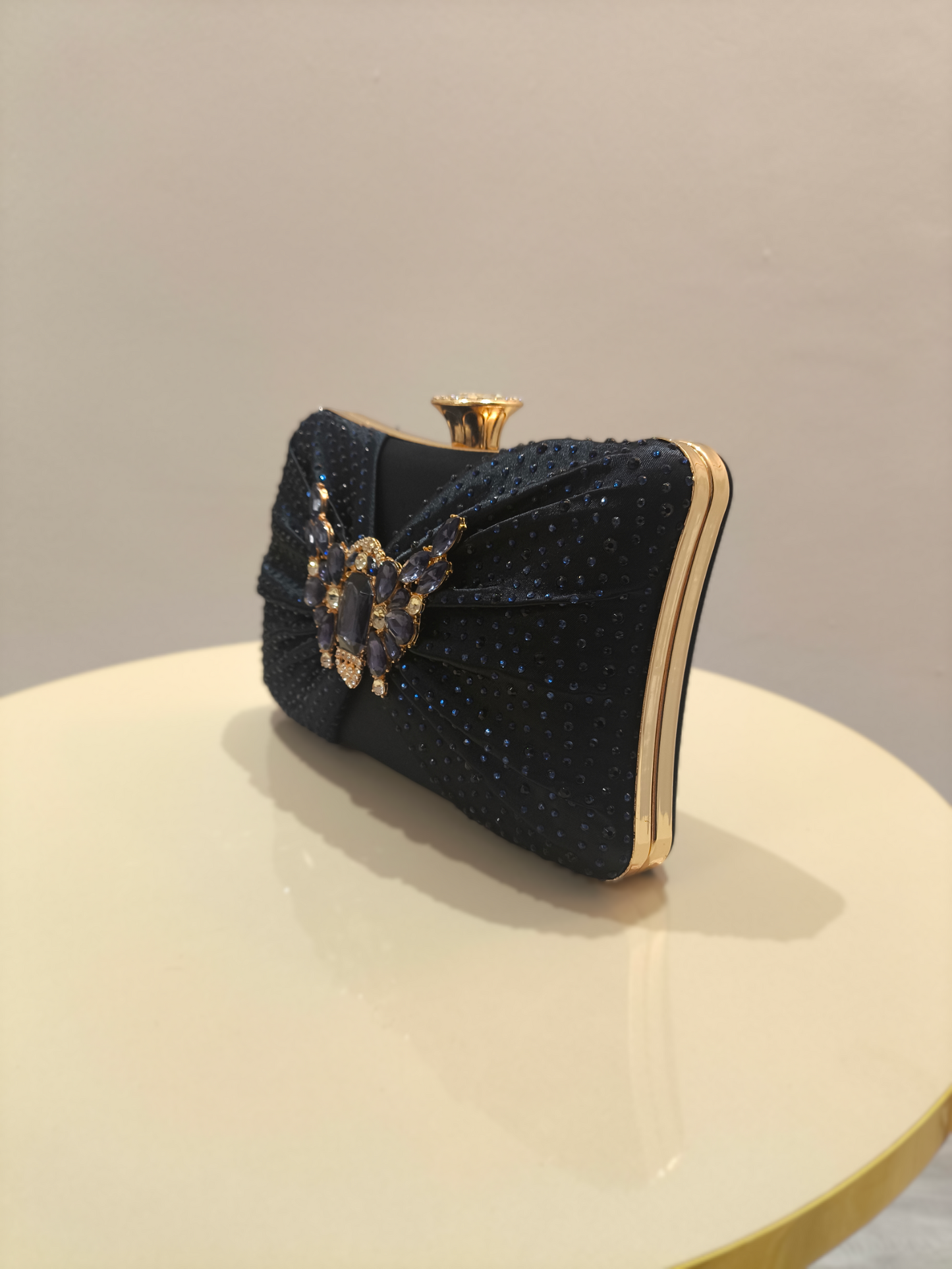 Stylish ladies clutch handbag with brooch