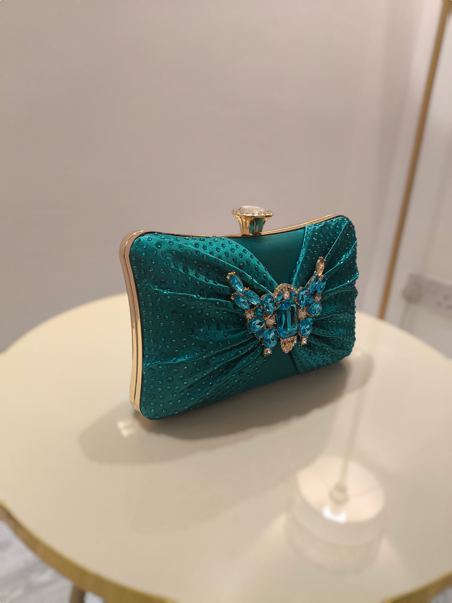 Stylish ladies clutch handbag with brooch